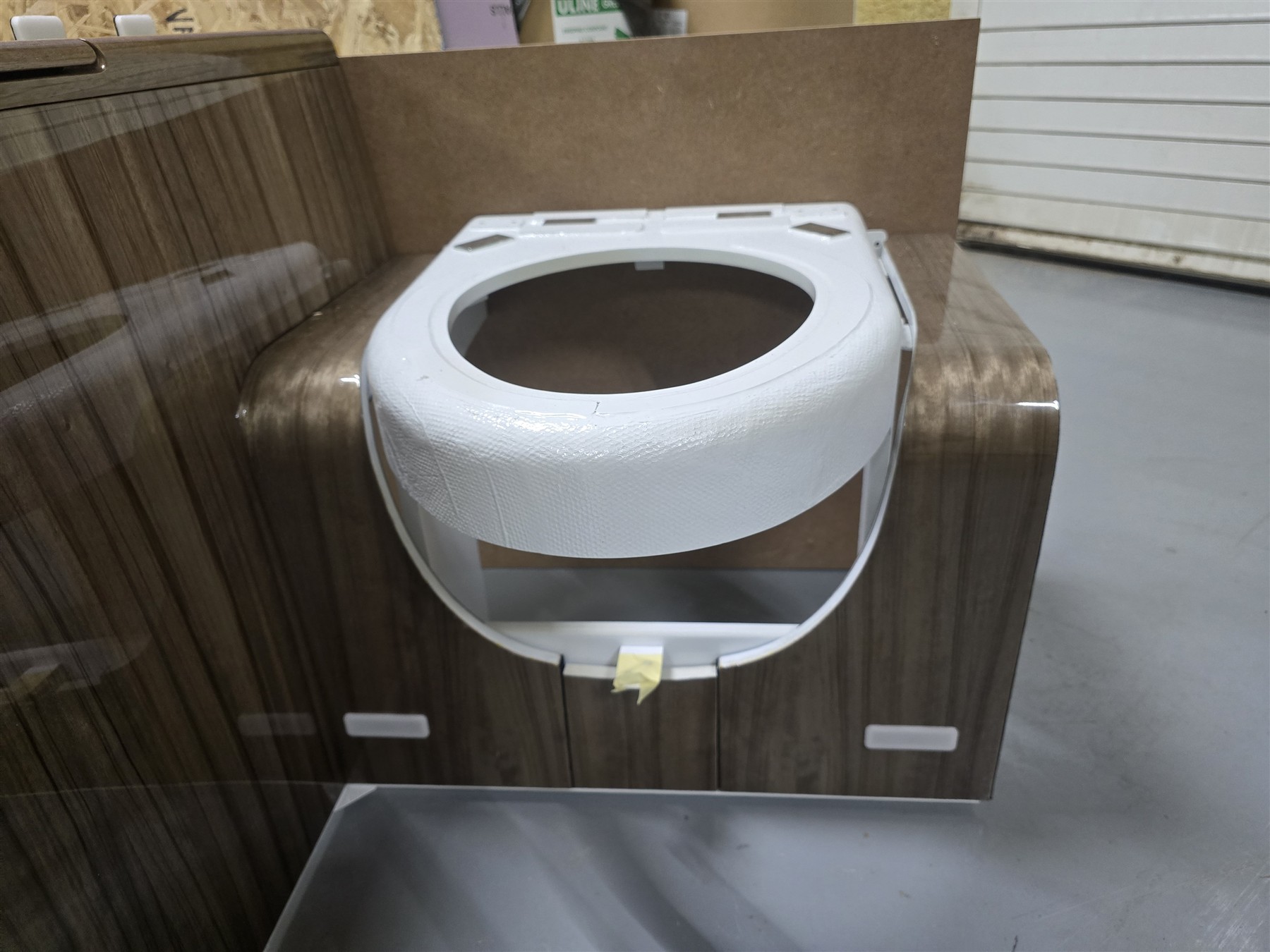 Veneered cabinetry with basin components.