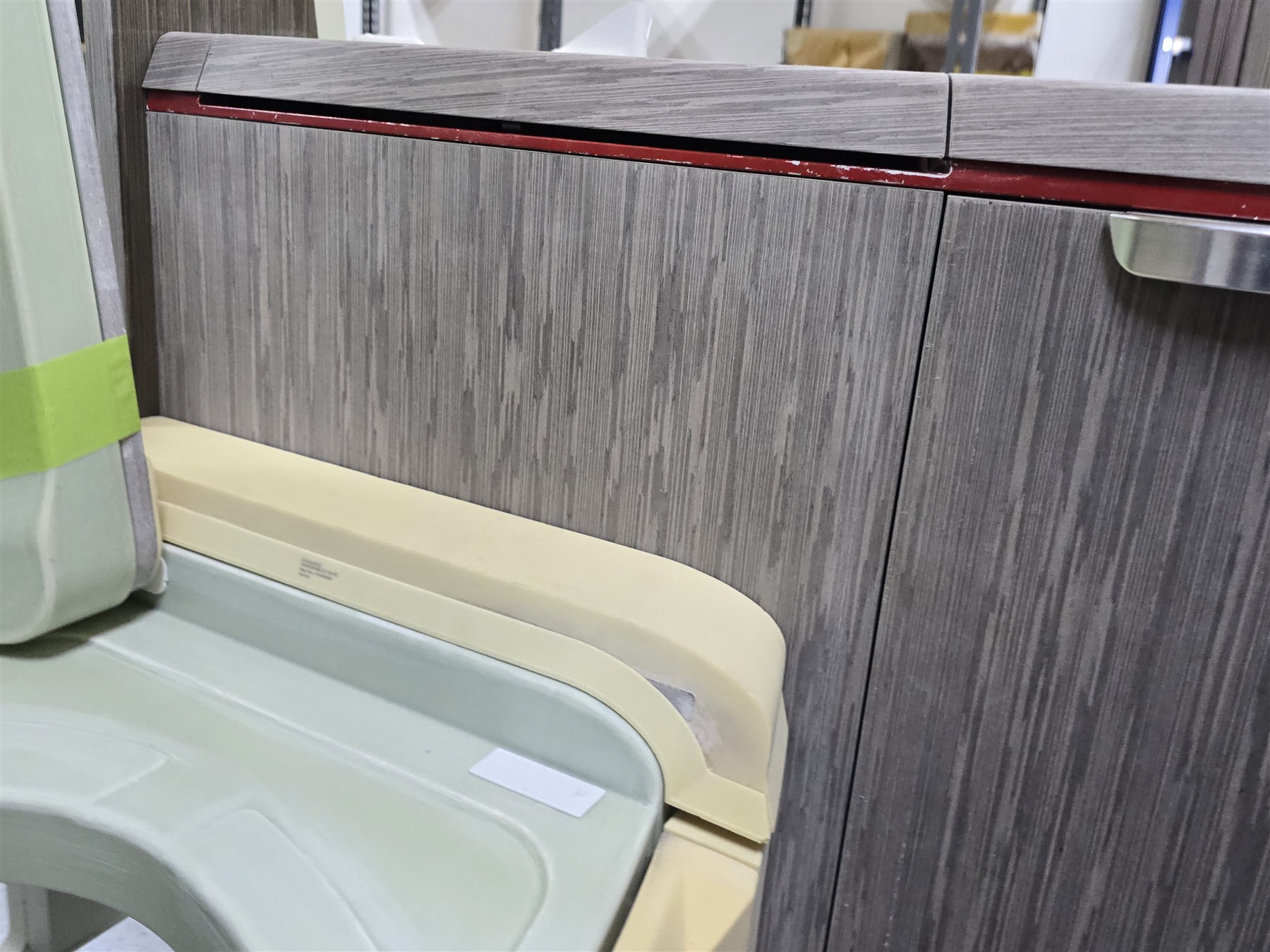 Close view of cabinetry, hardware and adjacent components.