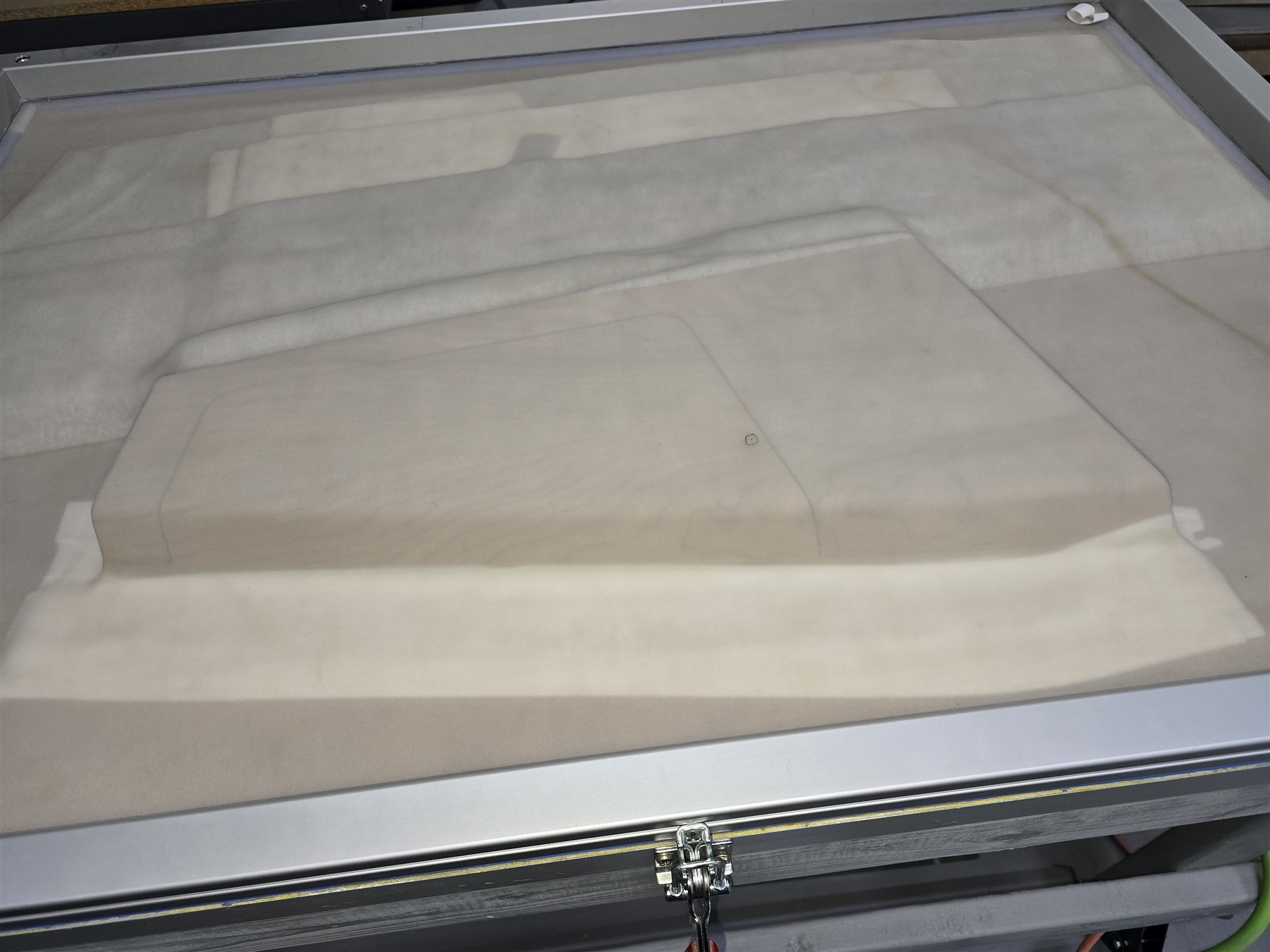 Lavatory ledge veneer during vacuum processing.